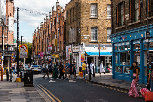 London, UK - August 25, 2023: Street scene with people shopping in Brick Lane in Shoreditch Area in the East End