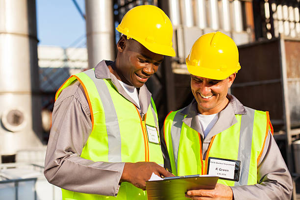 istock heavy industry workers working in plant 181171688