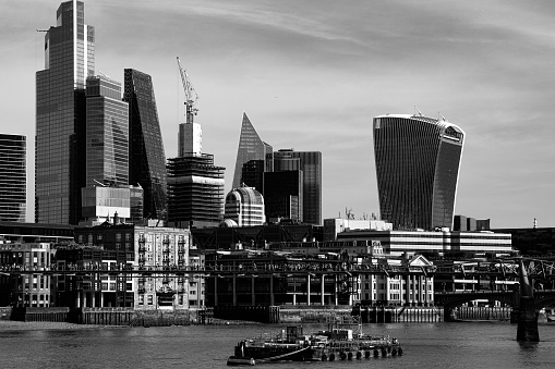 the London skyline in black and white with the presence of the River Thames