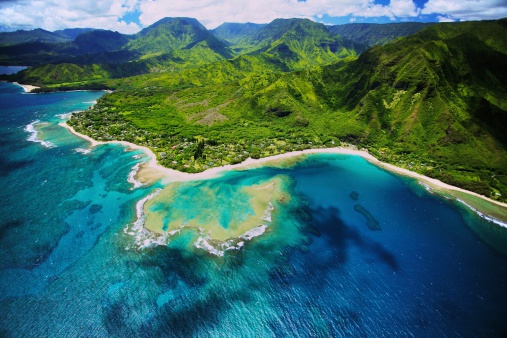 An aerial photo of Tunnels beach. Tunnels is located on Kauai's North Shore and is named after the \