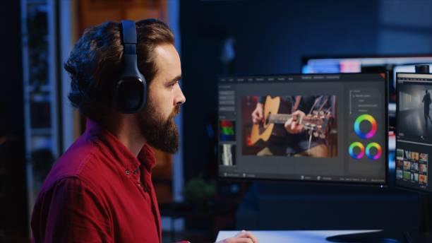istock Video editor adds sound effects to filmed footage, working in post production creative studio 1811720800