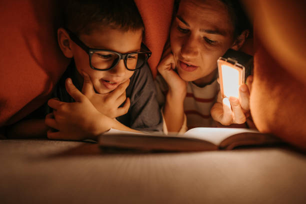 istock Schoolboy studying with his mother 1811721245