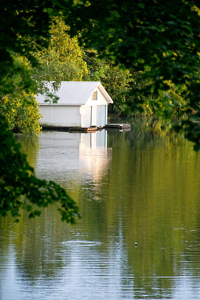 istock Vertical view of boat house in the setting sun 181172288