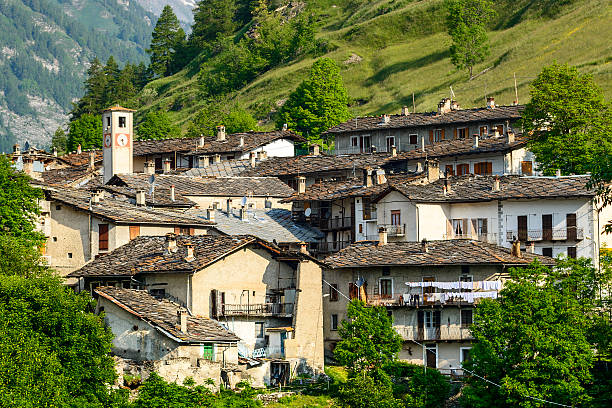 Key bridge Pontechianale (Cuneo, Val Varaita, Piedmont, Italy), the old village at summer and the Alps cuneo stock pictures, royalty-free photos & images