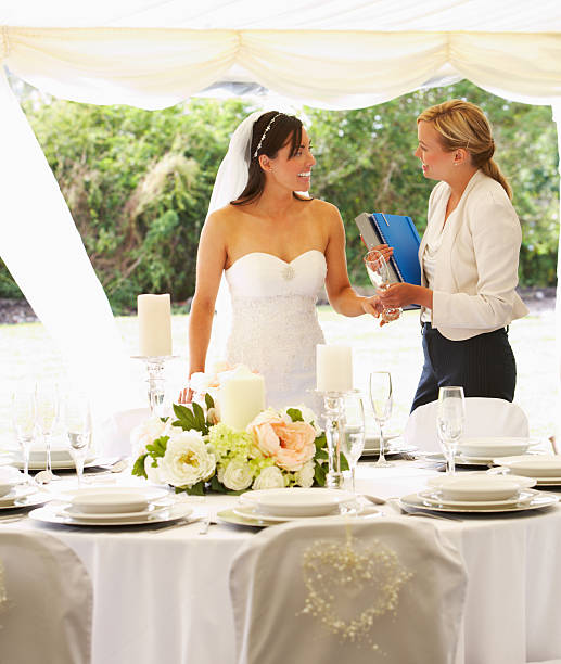 Bride With Wedding Planner In Marquee stock photo