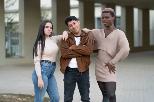 istock Three young people posing looking at the camera, with a gesture of empowerment. 1811754752