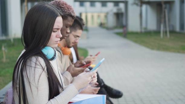 istock Digital Connection: young students absorbed in their virtual worlds 1811754769