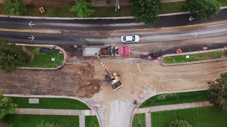 Aerial wide view over of road construction process in suburbs area