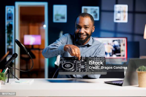 Influencer Offers Dj Controller Prize Stock Photo - Download Image Now - Adults Only, African Ethnicity, Apartment