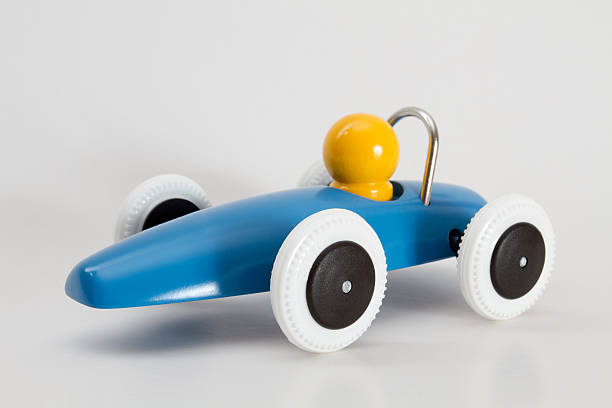 istock Blue race car with yellow driver isolated discreet shadow 181178652