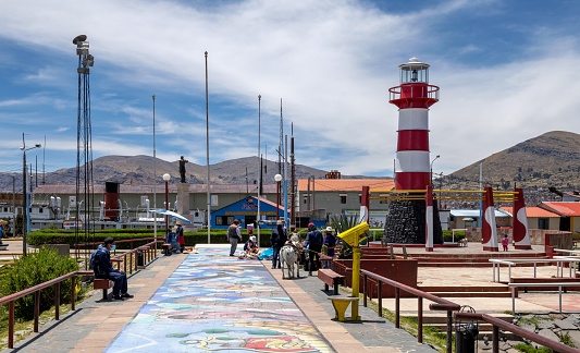 Puno, Peru, November 18: View of the lighthouse (Faro Titikaka) in the Peruvian town of Puno on the shores of the Titicaca Lake on a sunny day.