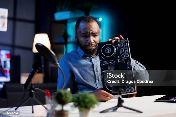 Reviewer Unhappy With Dj Controller Stock Photo - Download Image Now - Adults Only, African Ethnicity, Apartment