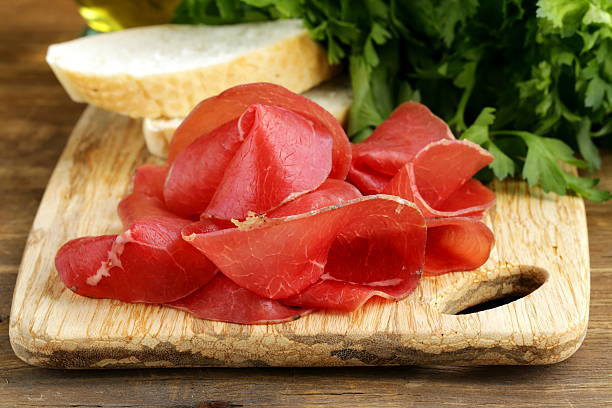 istock Smoked meat bresaola on a cutting board 181180450