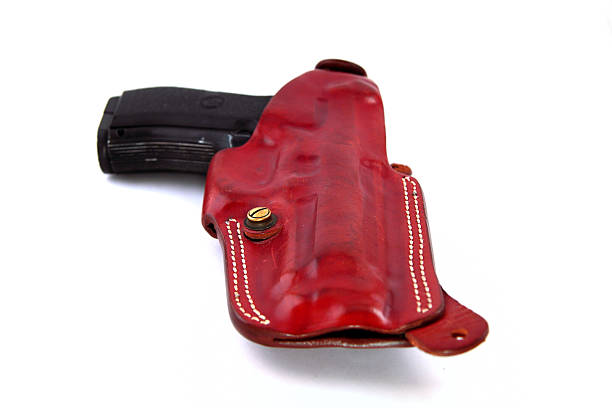 Isolated Gun 45 pistol in his Gun Holster (brown handmade leather-holster) forty five caliber handgun stock pictures, royalty-free photos & images