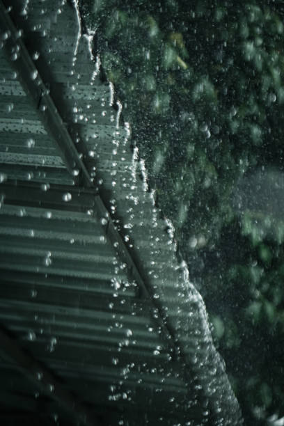 istock Rainwater falls from the light steel roof 1811824844