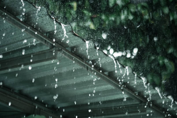 istock Rainwater falls from the light steel roof 1811824852