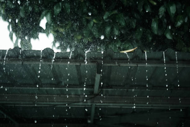 istock Rainwater falls from the light steel roof 1811825387