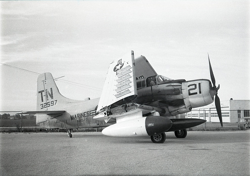 Douglas AD-5N Skyraider dive bomber with extra fuel tank and torpedo. Livingston Betsworth Field (Waterloo Municipal Airport), Waterloo, Iowa, USA 1953.