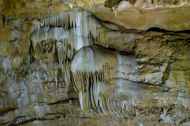 Cave with stalactites and stalagmites in the Caucasus Mountains. Huge underground cave.