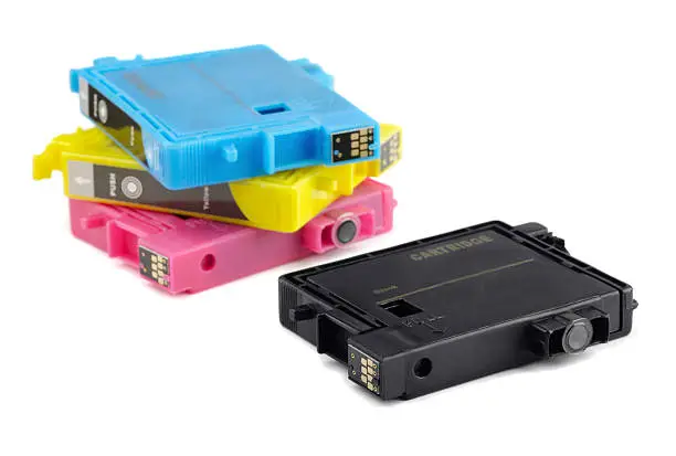 Photo of Four printer ink cartridges in black, yellow, blue and pink