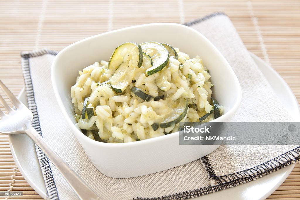 Risotto with zucchini Risotto with zucchini in a white bowl Close-up Stock Photo