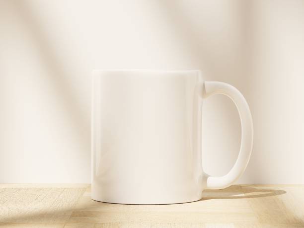 istock 11 oz Ceramic Mug on a Wooden Floor with Soft Window Shadows 1811913408