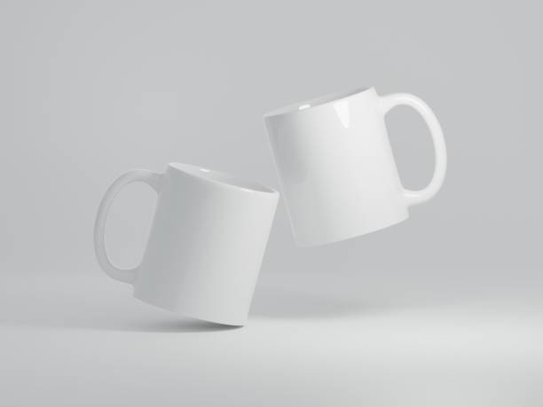 Mock up of two coffee cups floating on a white background