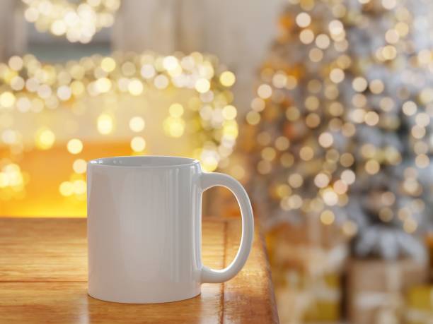istock White coffee cup with bright background lights unfocused in a Christmas scene 1811913663