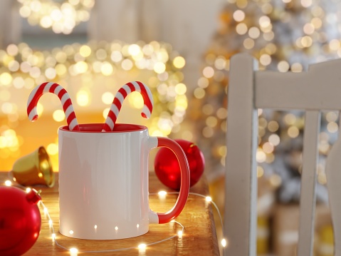 11 oz White and Red Ceramic Mug Mock Up with Bright Lights Unfocused and Christmas Decorations as 3D Rendering.