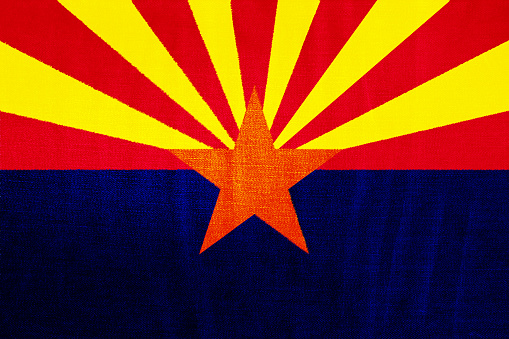 Flag of State of Arizona on a textured background. Concept collage.