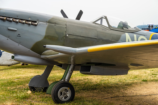 A classic Mk 1 Spitfire flies over the British countryside. Model photography.