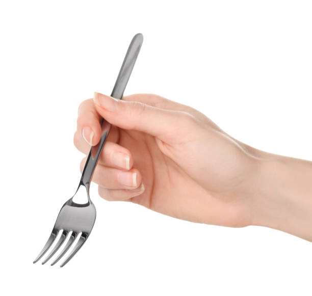 istock Woman holding clean fork on white background, closeup 1812001575