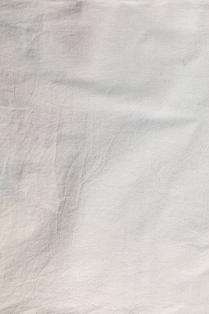 istock Eco-friendly natural material. White cotton fabric slightly wrinkled texture. 1812007006