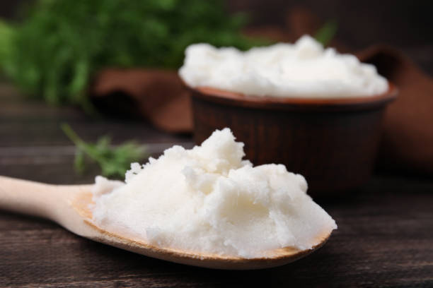 istock Spoon with delicious pork lard on wooden table, closeup 1812010728