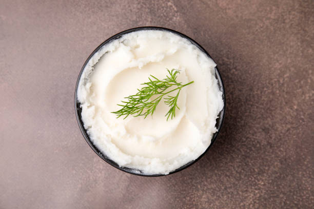 istock Delicious pork lard with dill in bowl on brown table, top view 1812011267