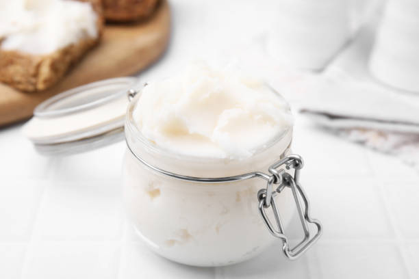 istock Delicious pork lard in glass jar on white table, closeup 1812012884