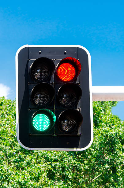 istock Red and green traffic lights on blue sky 181201907