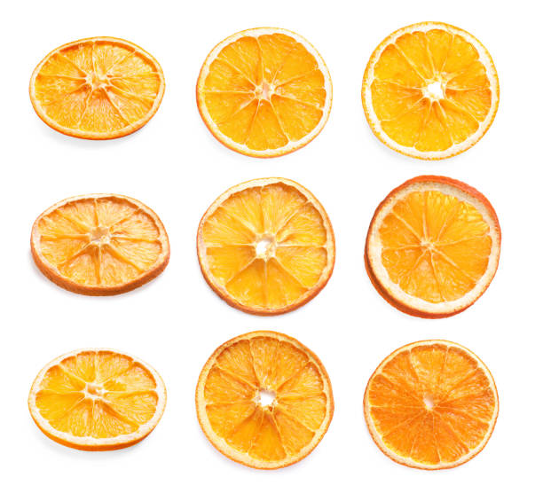 istock Many dry orange slices on white background 1812019385