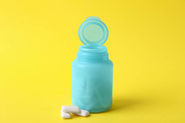 istock Jar with chewing gums on yellow background 1812021686