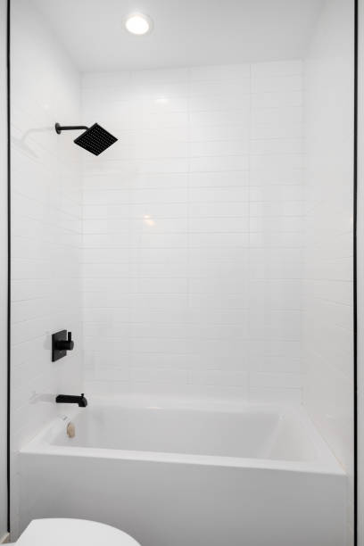 istock A shower and bathtub with white subway tiles. 1812027044
