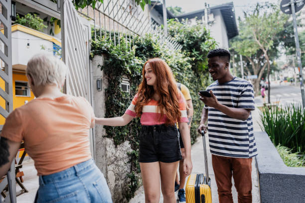 istock Traveler friends entering at hostel 1812036539