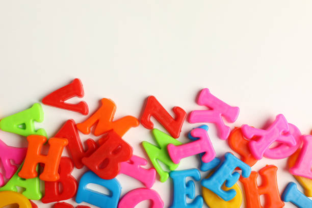istock Many colorful magnetic letters on white background, flat lay. Space for text 1812058323