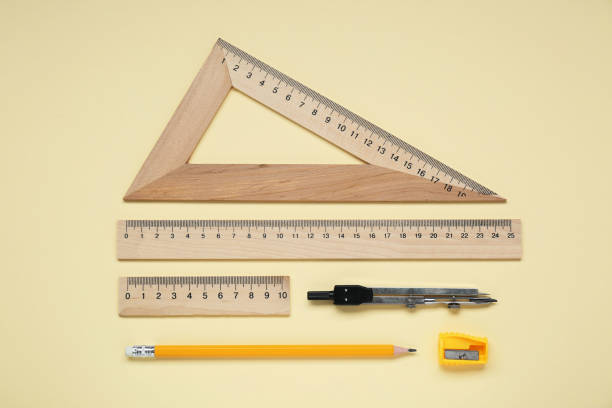 istock Flat lay composition with different rulers and compass on yellow background 1812059356