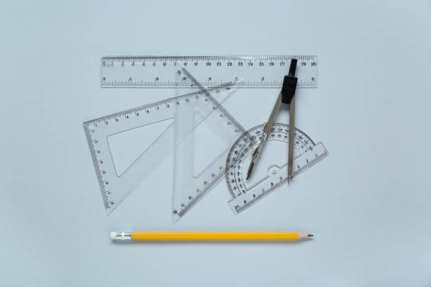 istock Different rulers with measuring length markings and compass on light grey background, flat lay 1812059467