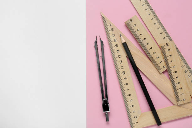 istock Different rulers, pencil and compass on color background, flat lay. Space for text 1812060518