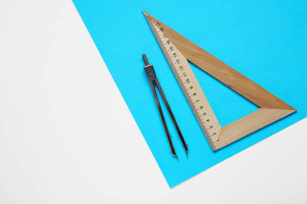 istock Triangle ruler, paper sheet and compass on white background, flat lay 1812060871