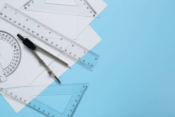 istock Flat lay composition with different rulers and compass on light blue background. Space for text 1812061570