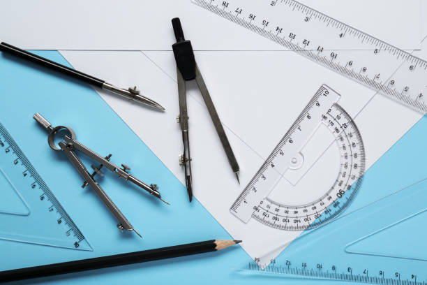 istock Flat lay composition with different rulers, pencil and compasses on light blue background 1812061571