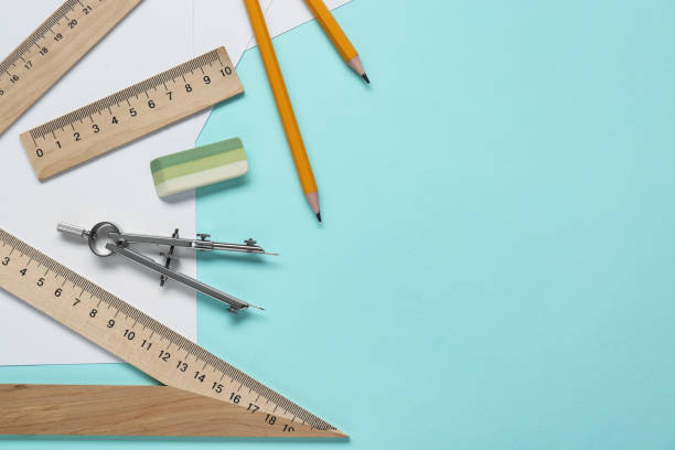 istock Different rulers and compass on turquoise background. Space for text 1812061583