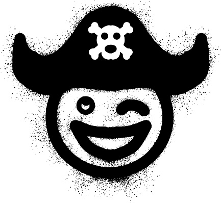 Smiling emoticon graffiti wearing a pirate hat with black spray paint